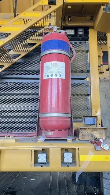 Foam cylinder mounted beside the access ladder