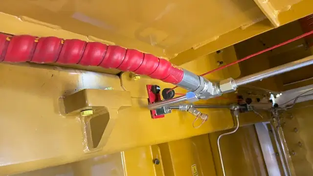 Discharge hose with a protective sleeve, running into its fitting