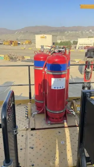 Two foam cylinders on a machine deck behind the handrail
