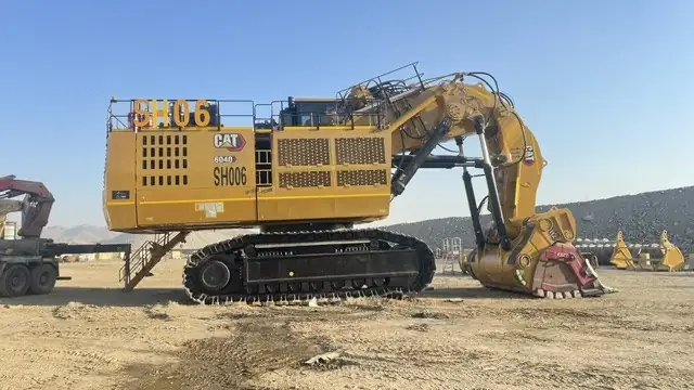 Excavator on an open site, fitted with a fire suppression system