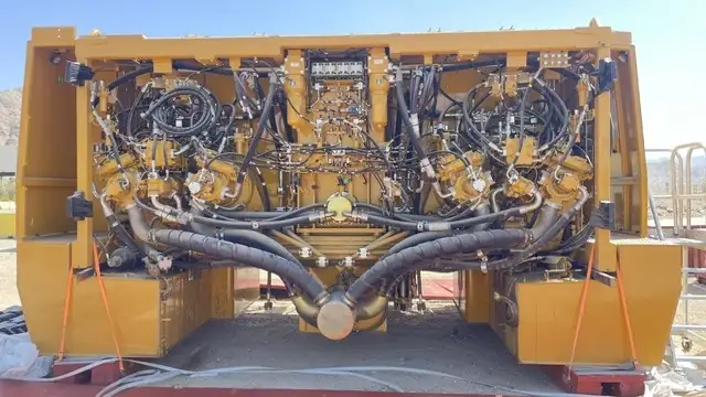 Rear of a haul truck with the engine bay open