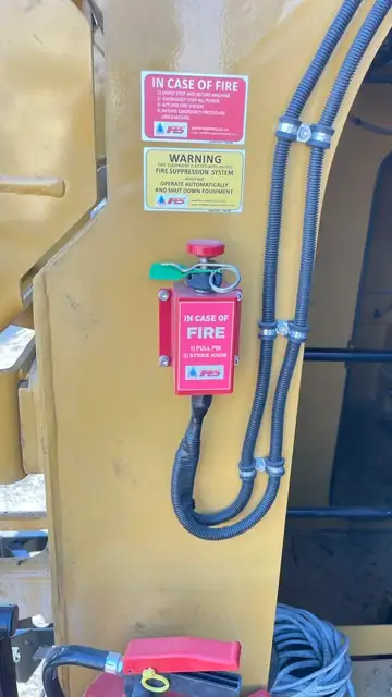 Manual actuator on the cab, marked for the operator